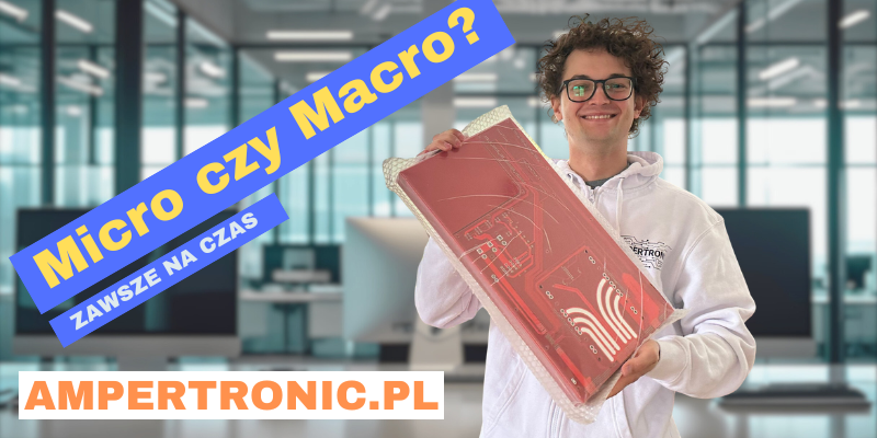 Pracownik Ampertronic prezentuje dużą czerwoną płytkę PCB – montaż elektroniki, produkcja obwodów drukowanych, szybkie dostawy.